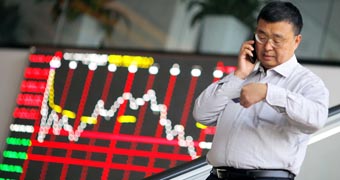 Chinese investor on the phone as market falls