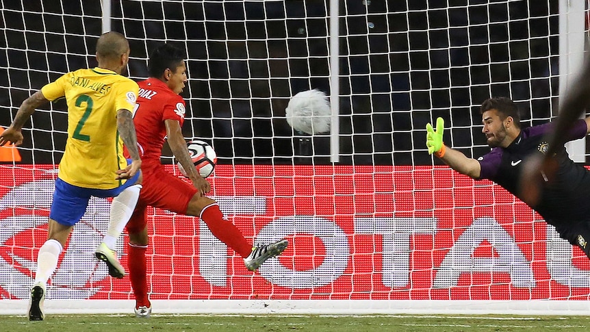 Raul Ruidiaz scores for Peru against Brazil with his hand