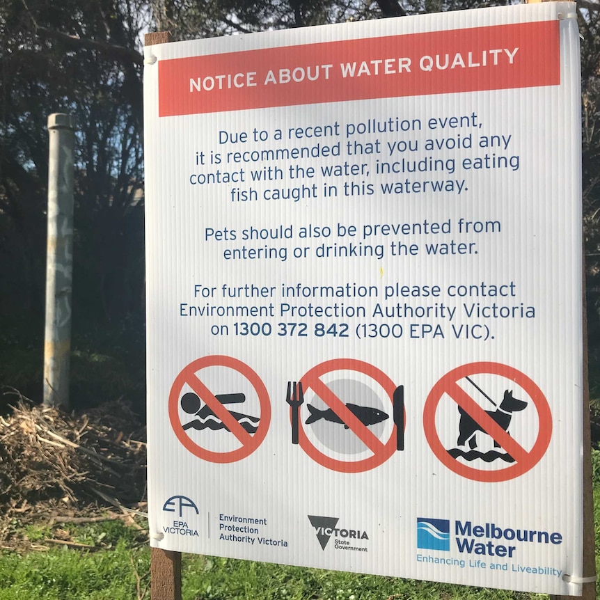 A sign on Stony Creek warning people to stay out of the water due to a recent pollution event.