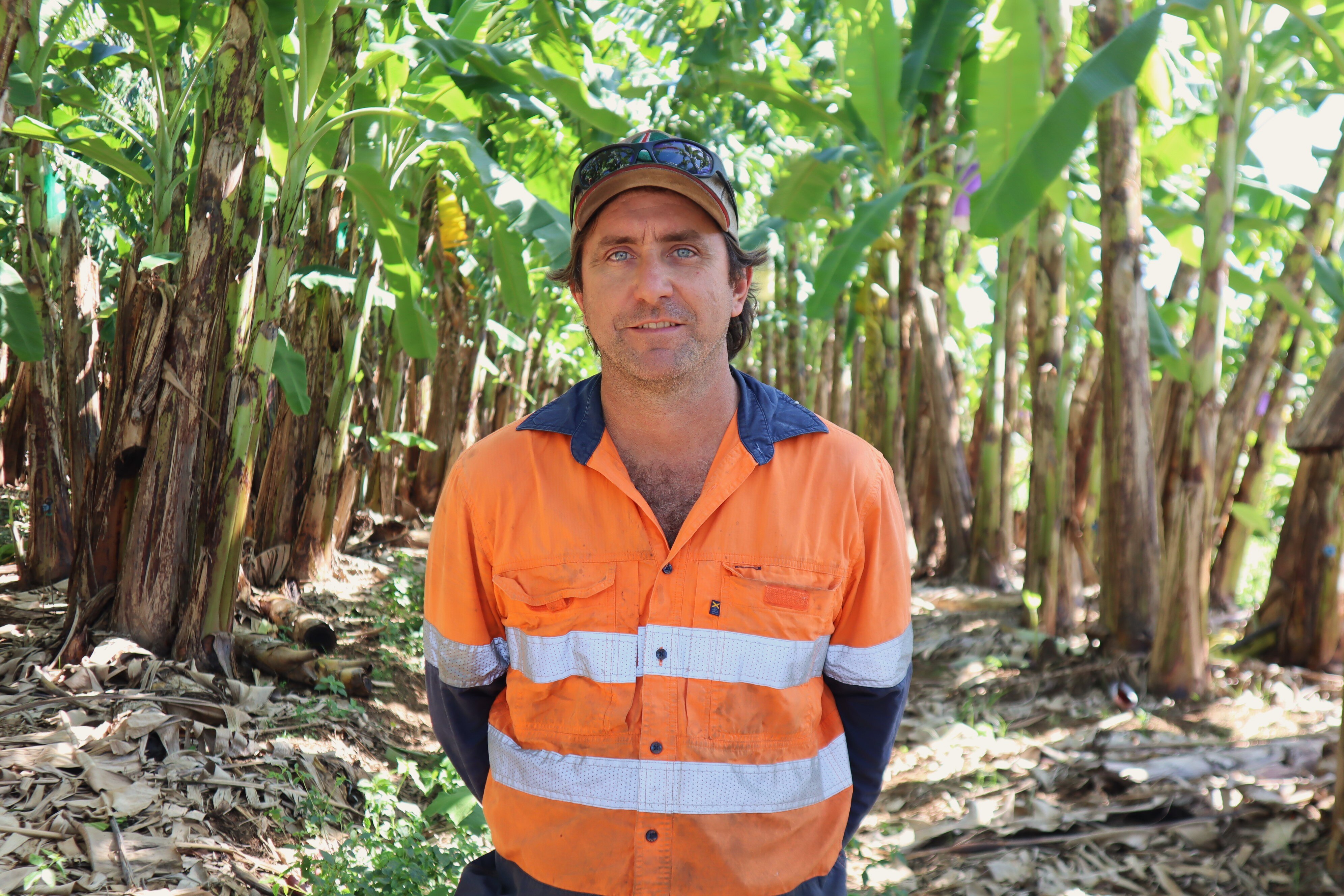 Dean Sinton with banana trees.