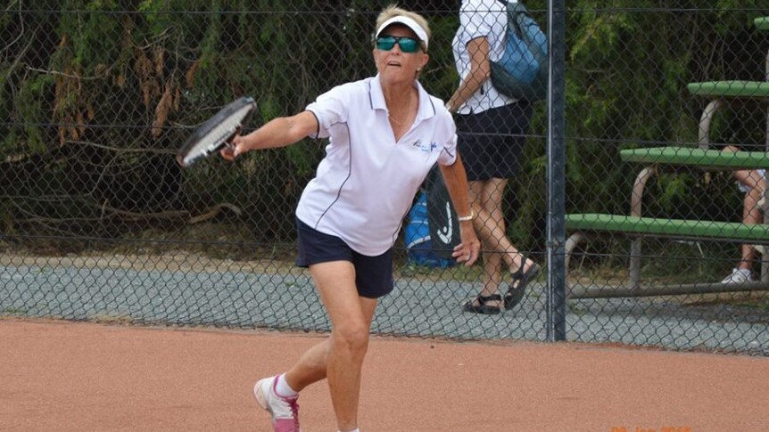 Nola Collins playing tennis in 2015.