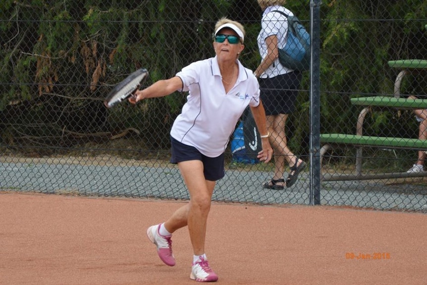 Nola Collins playing tennis in 2015.