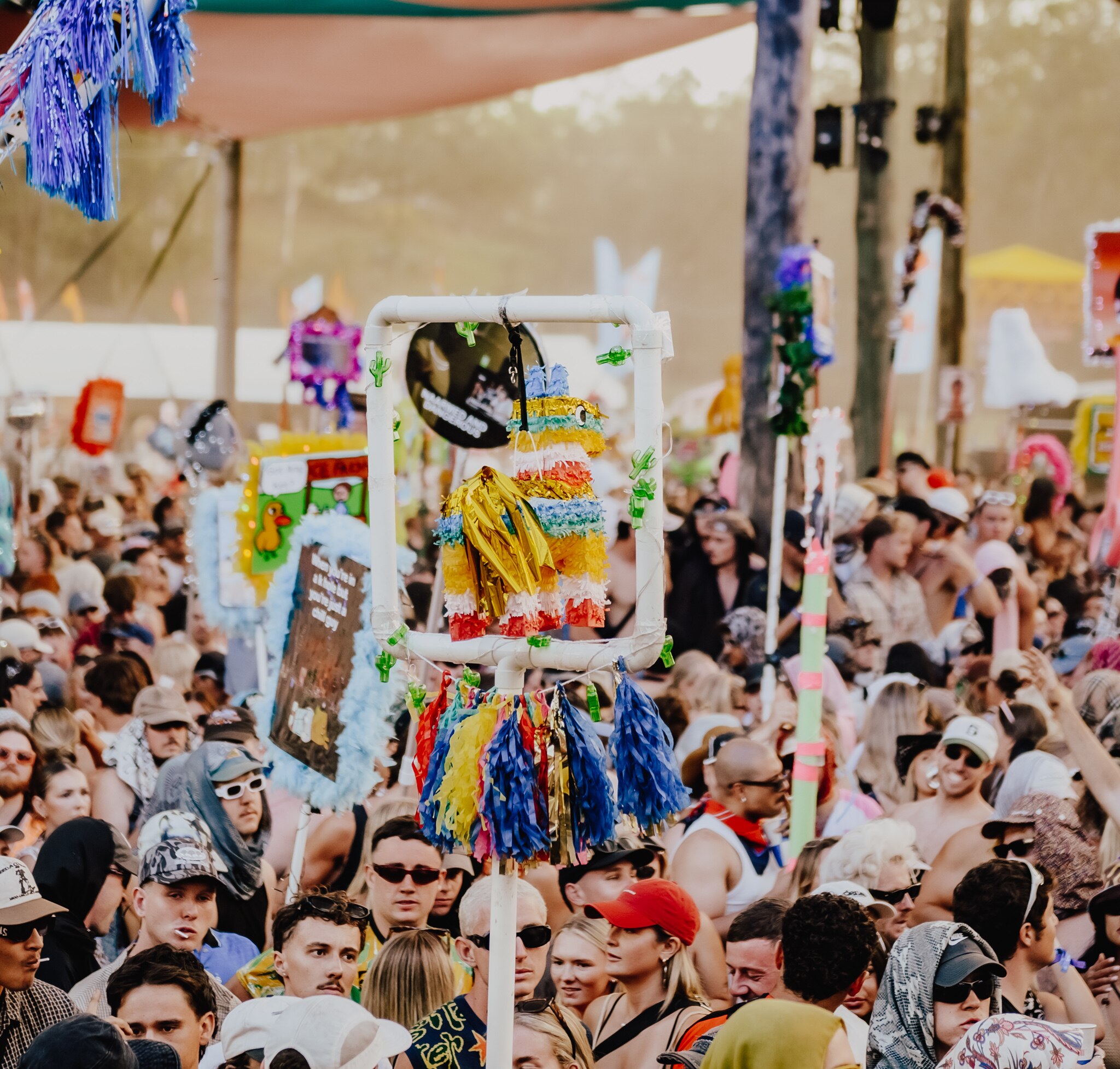 A photo of punters with doof sticks during the daytime at Lost Paradise 2024.