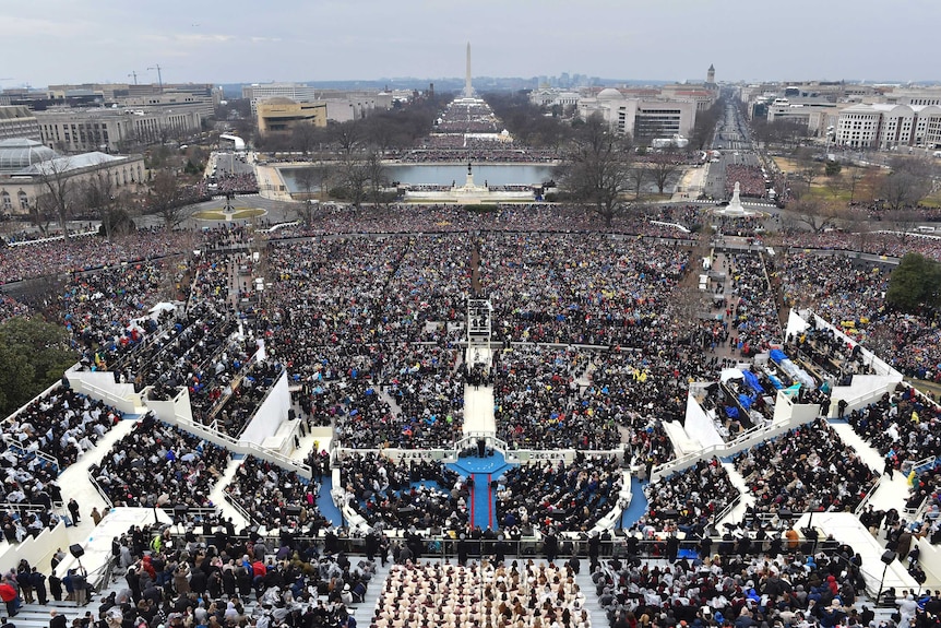 Crowds watch as President Donald Trump delivers his inaugural address.