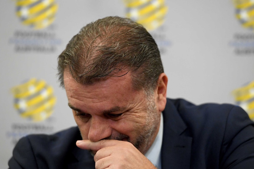 Ange Postecolou holds back the emotion during press conference