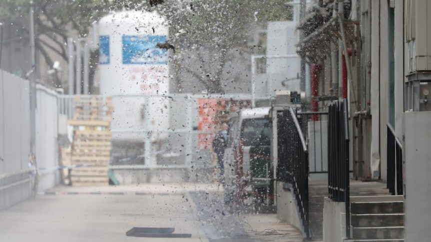 A grenade blowing up in an industrial area.