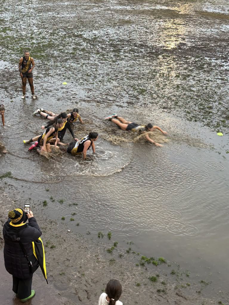 Deluge forces footy play to halt and cars to wash away