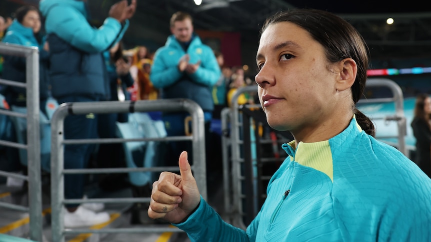 Australia's football superstar Sam Kerr looks sad but gives a thumbs up to the crowd after the Matildas Women's World Cup loss.