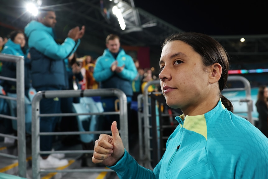 Australia's football superstar Sam Kerr looks sad but gives a thumbs up to the crowd after the Matildas Women's World Cup loss.