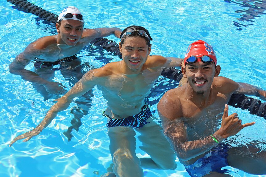 Three Indonesian swimmers in the Tweed Aquatic Centre pool at Murwillumbah