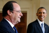 Barack Obama listens as French president Francois Hollande addresses a joint news conference in the White House on February 11, 2014