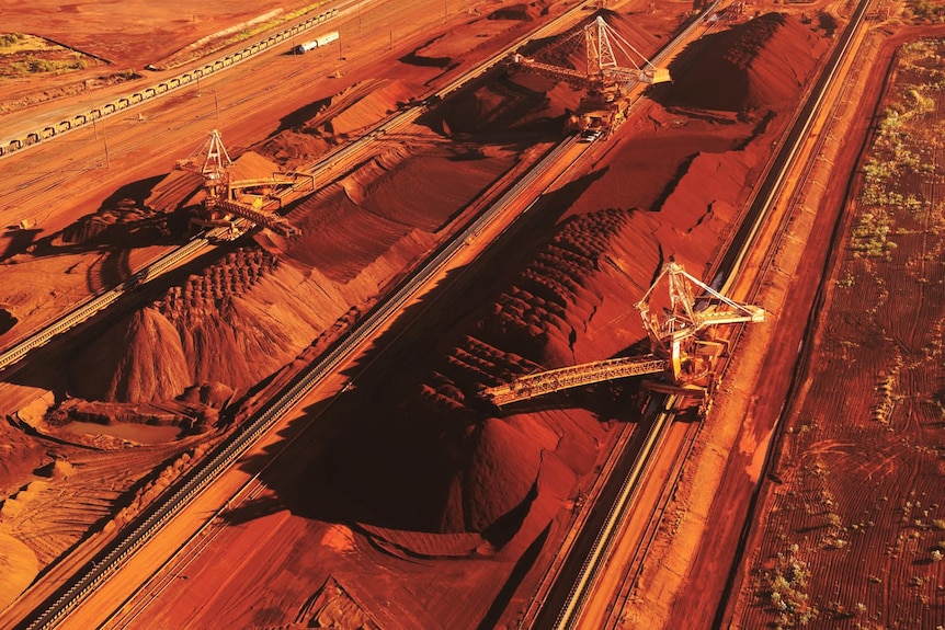 Red dirt with mining equipment on top.