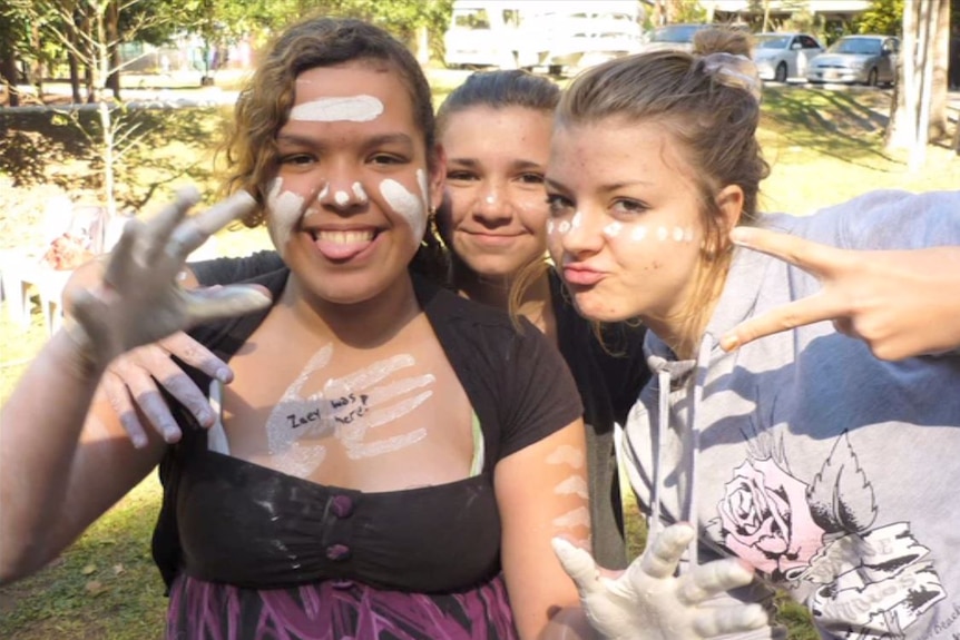 Three girls with face paint