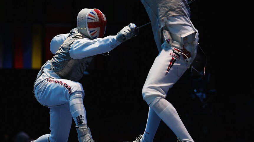 Briton Richard Kruse competes against Sherif Farrag of Egypt during the men's foil team fencing