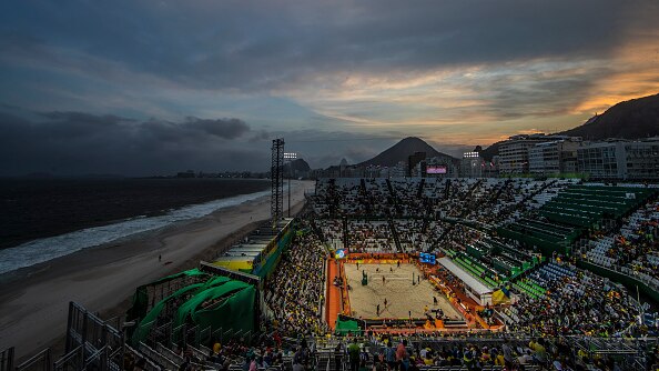 The men's Olympic beach volleyball quarterfinals during a sunset on Copacabana beach in Rio de Janeiro.