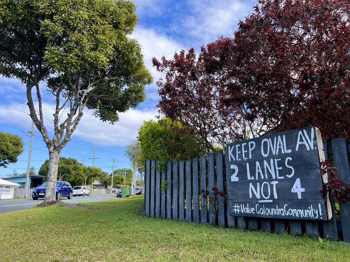 Protest sign reads 'keep oval avenue, two lanes not four'