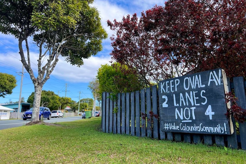 Protest sign reads 'keep oval avenue, two lanes not four'