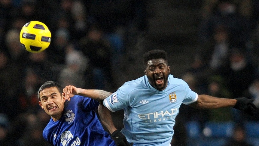 Cahill and Toure fight for the ball