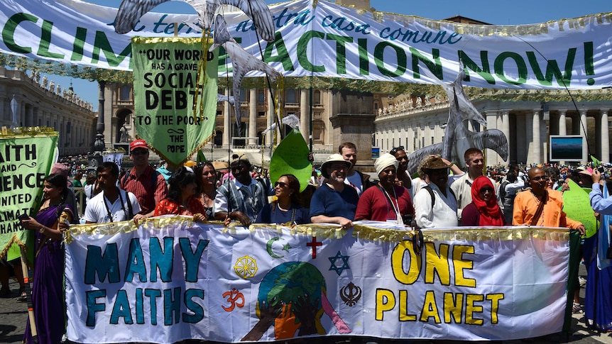 Inter-religious activists march in the Vatican in support of Pope Francis' call for action on climate change