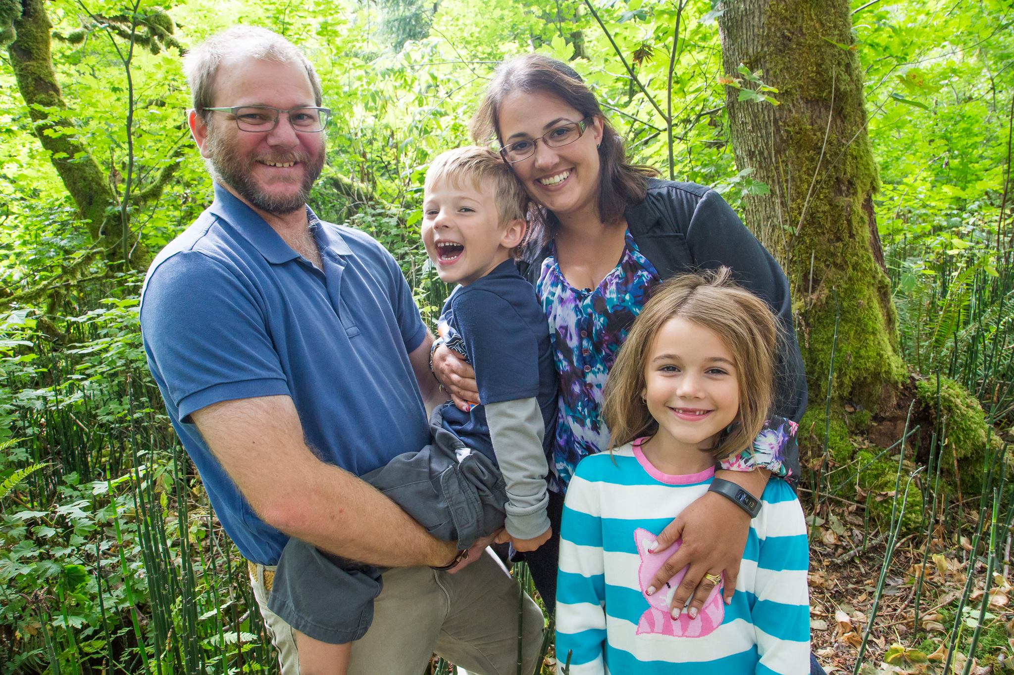 A man and his family in the bush. 