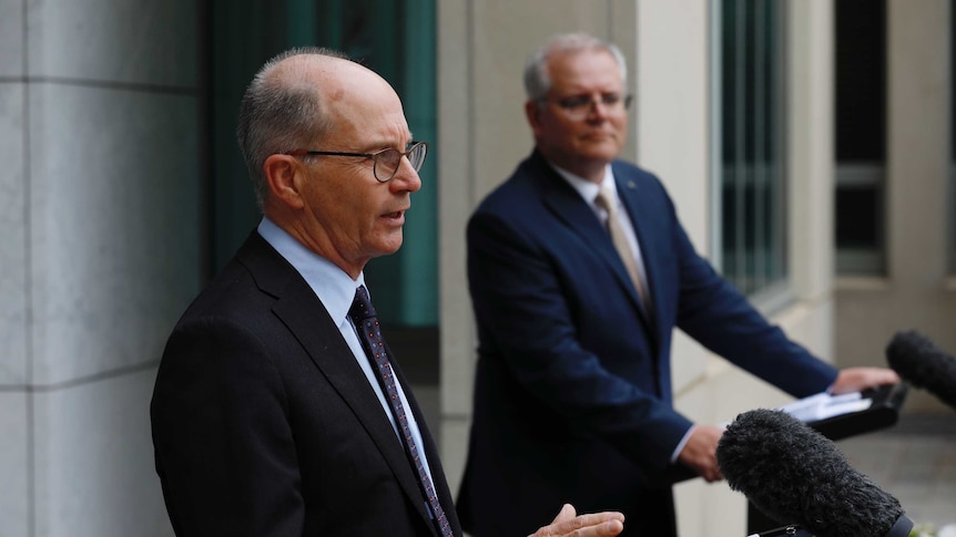 Two men standing at a podium