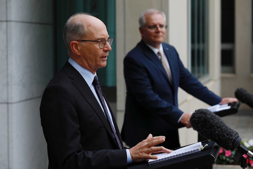 Two men standing at a podium