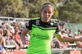 Ash Sykes dribbles the ball for Canberra United