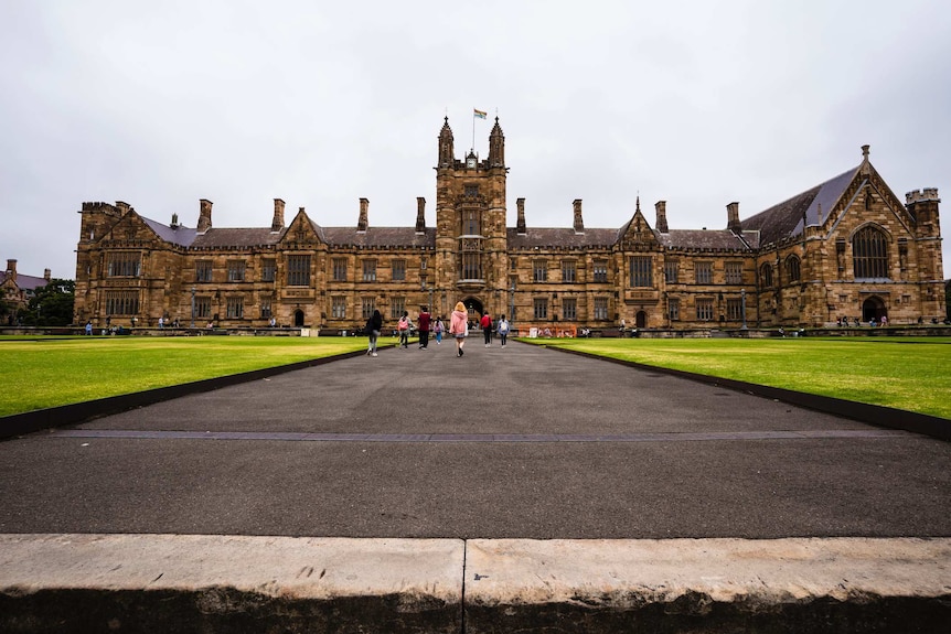 Quadrangle at University of Sydney, with a road and green grass