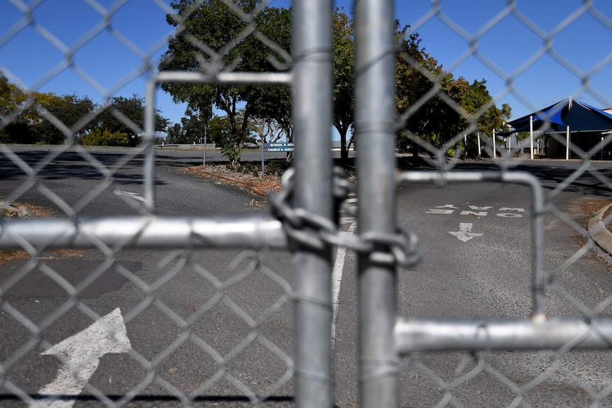 A locked gate at the entrance to Parklands Christian College in Logan.