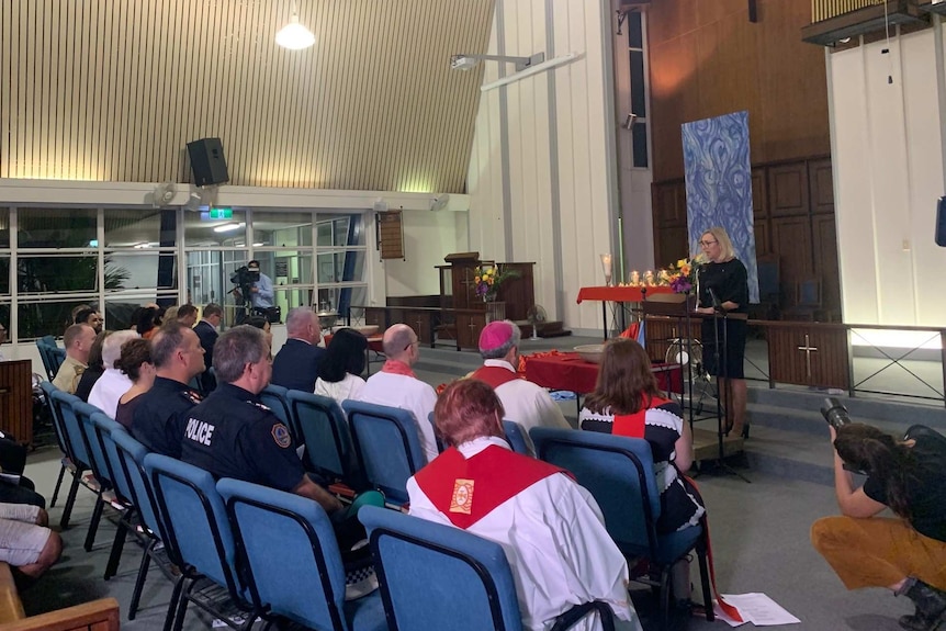Police and emergency services members were among the crowd gathered at Darwin's Uniting Church.