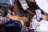 Rescue workers pull baby boy from rubble