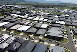 A drone shot of a suburban housing estate.