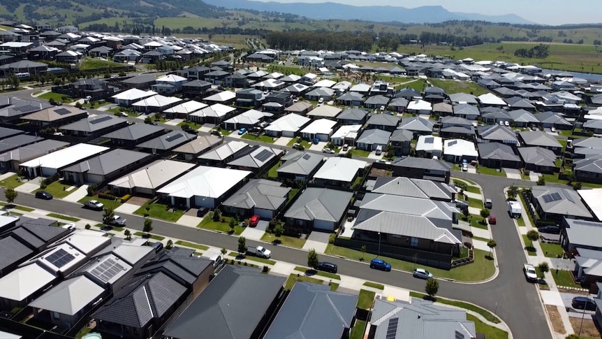 A drone shot of a suburban housing estate.