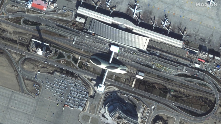 Satellite imagery shows Tehran airport, including a mostly full carpark.