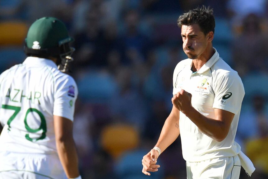 Australia bowler Mitchell Starc pumps his fist as Azhar Ali leaves the field of play during a Test.