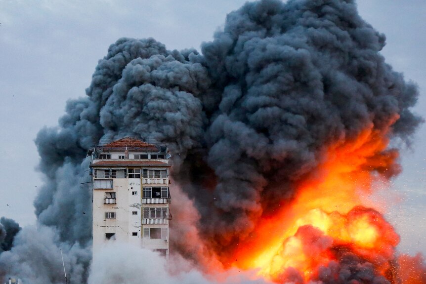 Smoke and flames billow after Israeli forces struck a high-rise tower in Gaza.