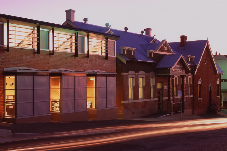 A photo of the outside of an historic building taken with evening light