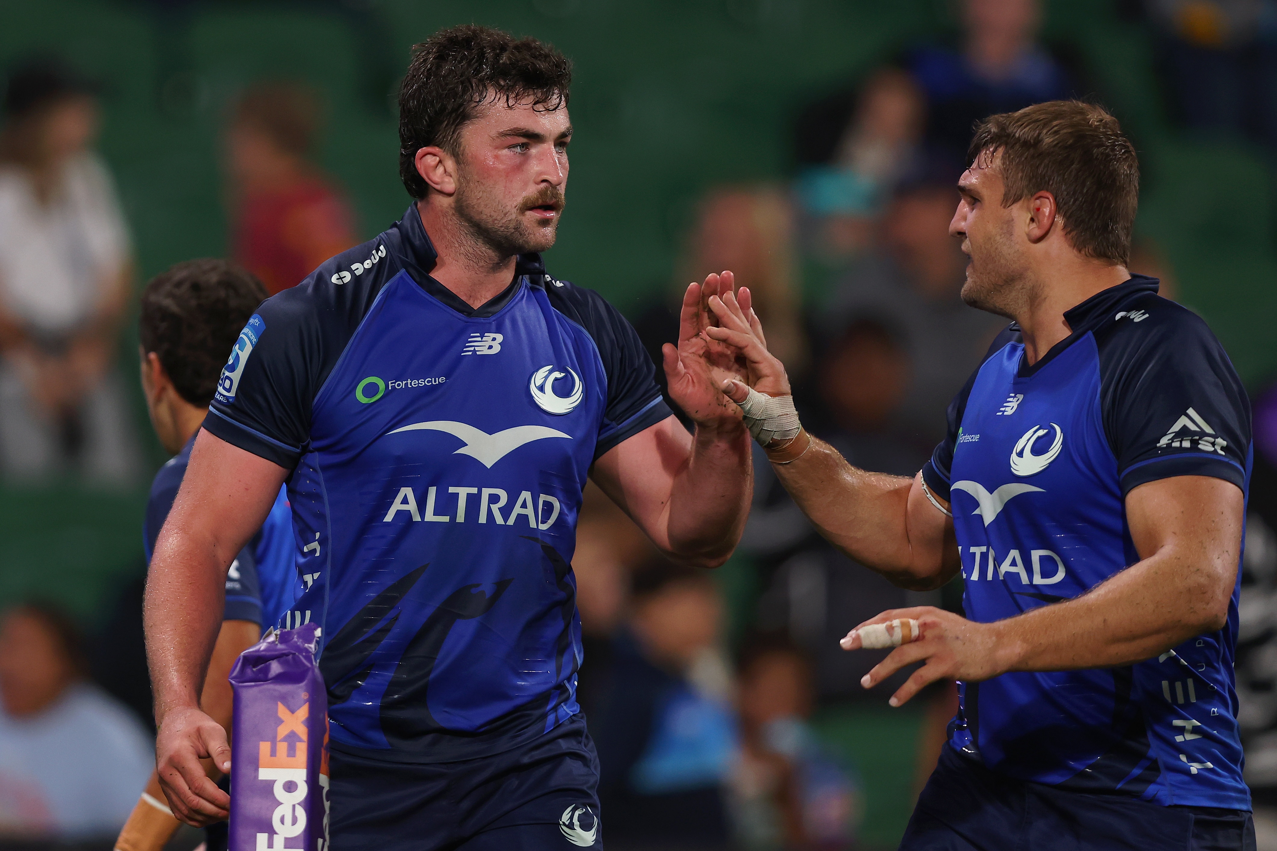 Jeremy Williams and Nick Champion de Crespigny shake hands during a Western Force match.