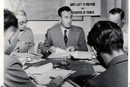 Lord Mountbatten works with his advisors to divide India peaceably