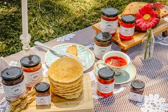 glass jars on white table cloth with pancakes 