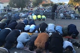 Crowds praying in front of the Lakemba Mosque this morning.