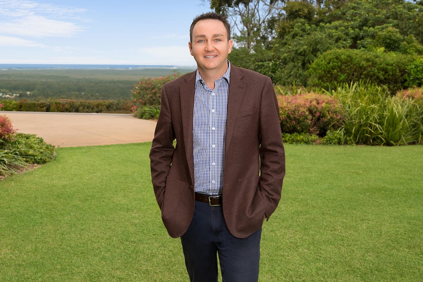 Man standing in large open park