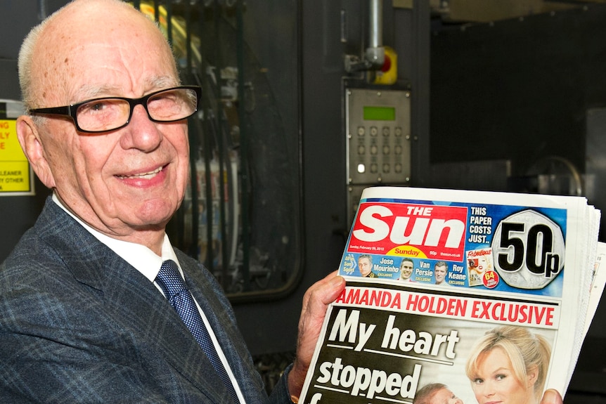 Murdoch shows off The Sun on Sunday (News International Group via AFP: Arthur Edwards)