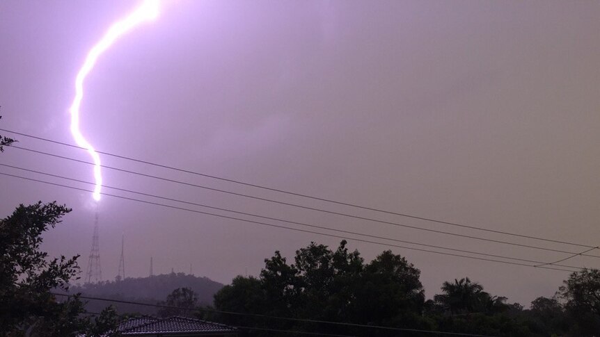 Lightning strikes a TV tower on Mount Coot-tha
