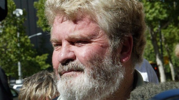 Media surround former ATSIC chairman Geoff Clark as he walks out of the Victoria County Court in Melbourne on January 31, 2007.