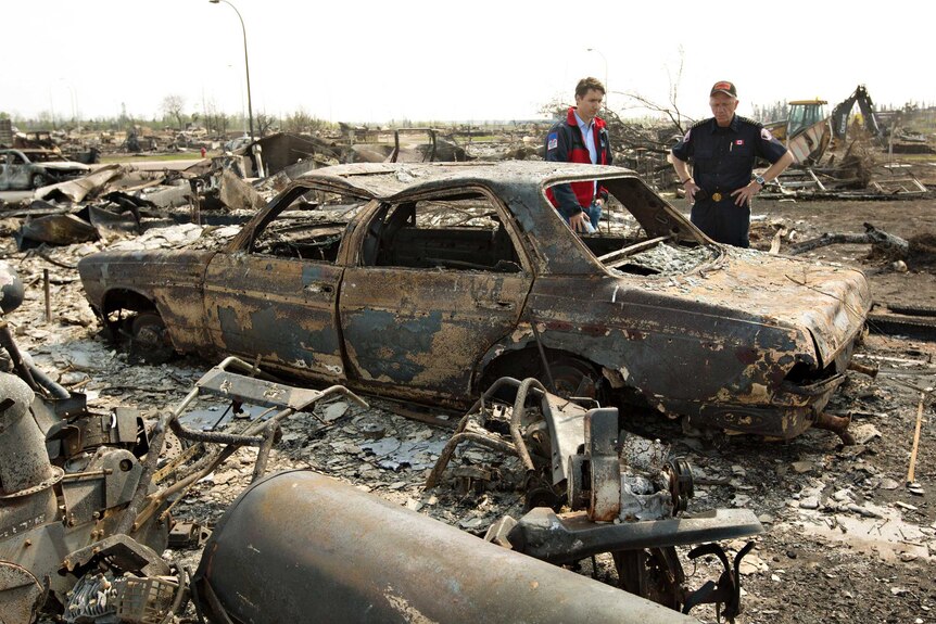 Justin Trudeau and Fort McMurray fire chief inspect damage