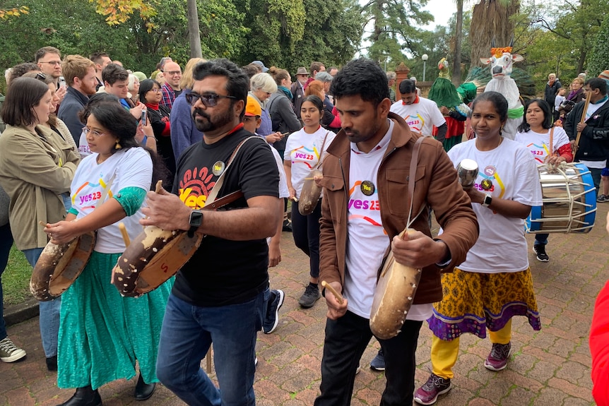 Australia Tamil Arts hold musical instruments as they perform at Come Together For Yes