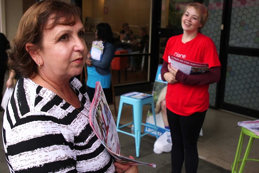 Diane Beamer, Labor candidate for Lindsay, handing out election pamphlets on a street in Penrith