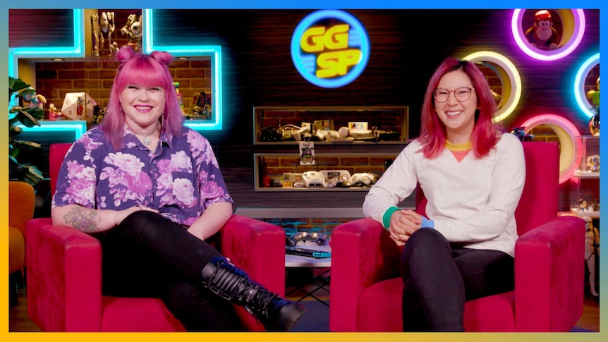 Gem & Rad are sitting in the couches smiling to camera on the GGSP studio set.