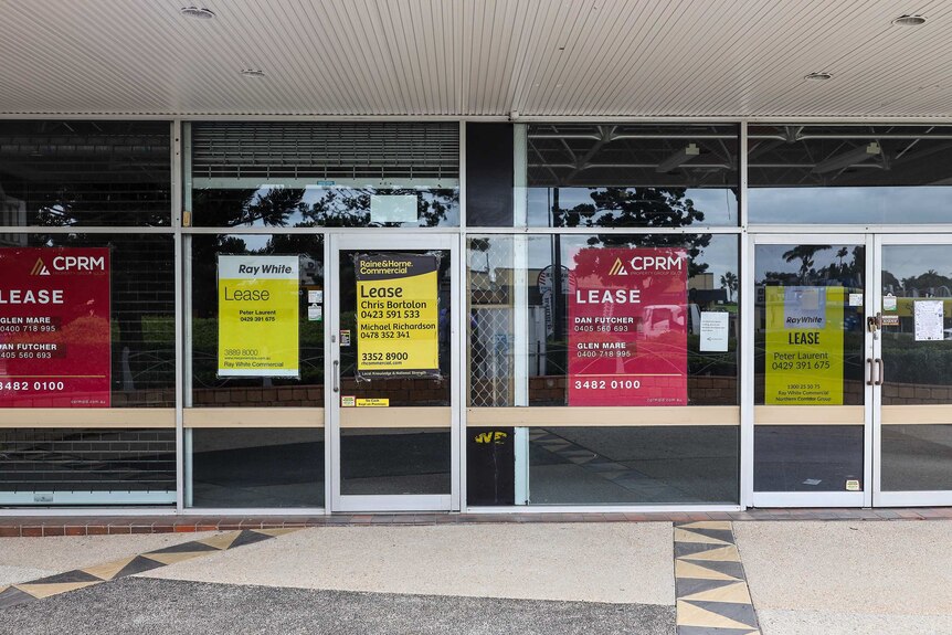 Empty shops on Gympie Road at Strathpine with 'Lease' signs in the window in April 2019.